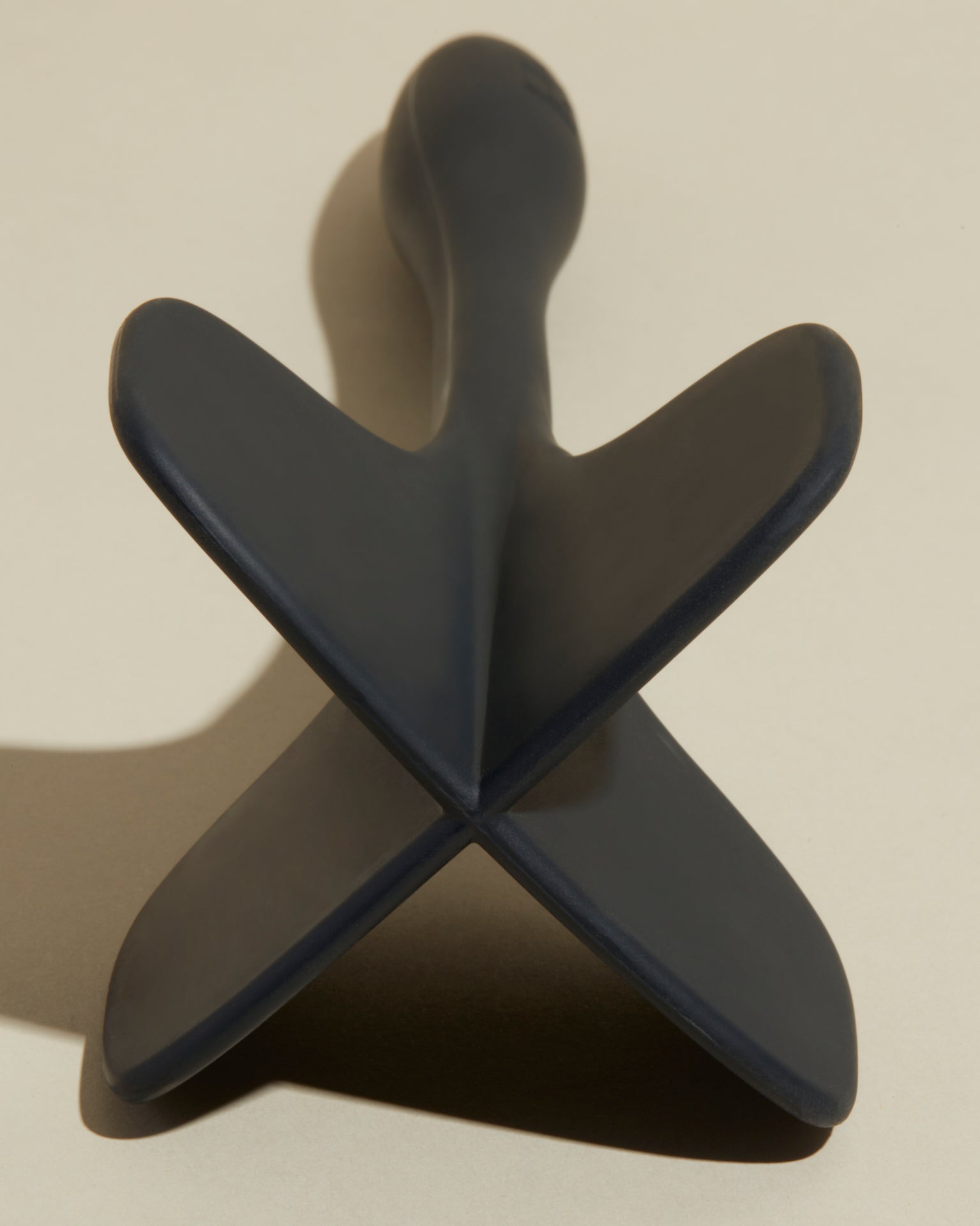 Close-up image of the GIR Black Quad Chopper on a cream background.