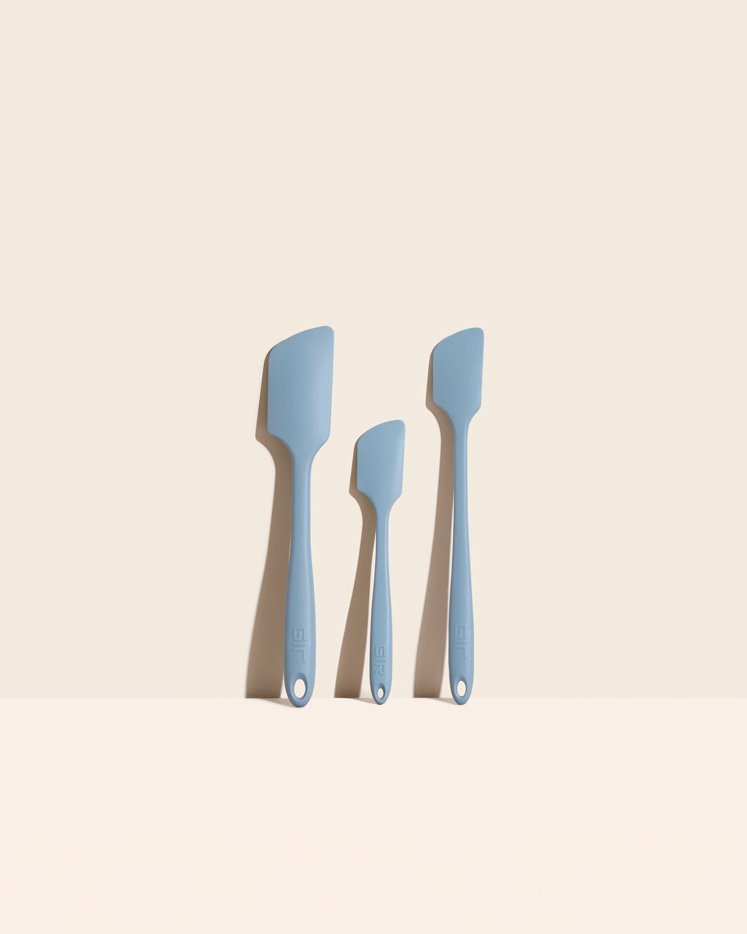 The GIR Earl Gray  3 Piece Spatula Set on a cream background. 