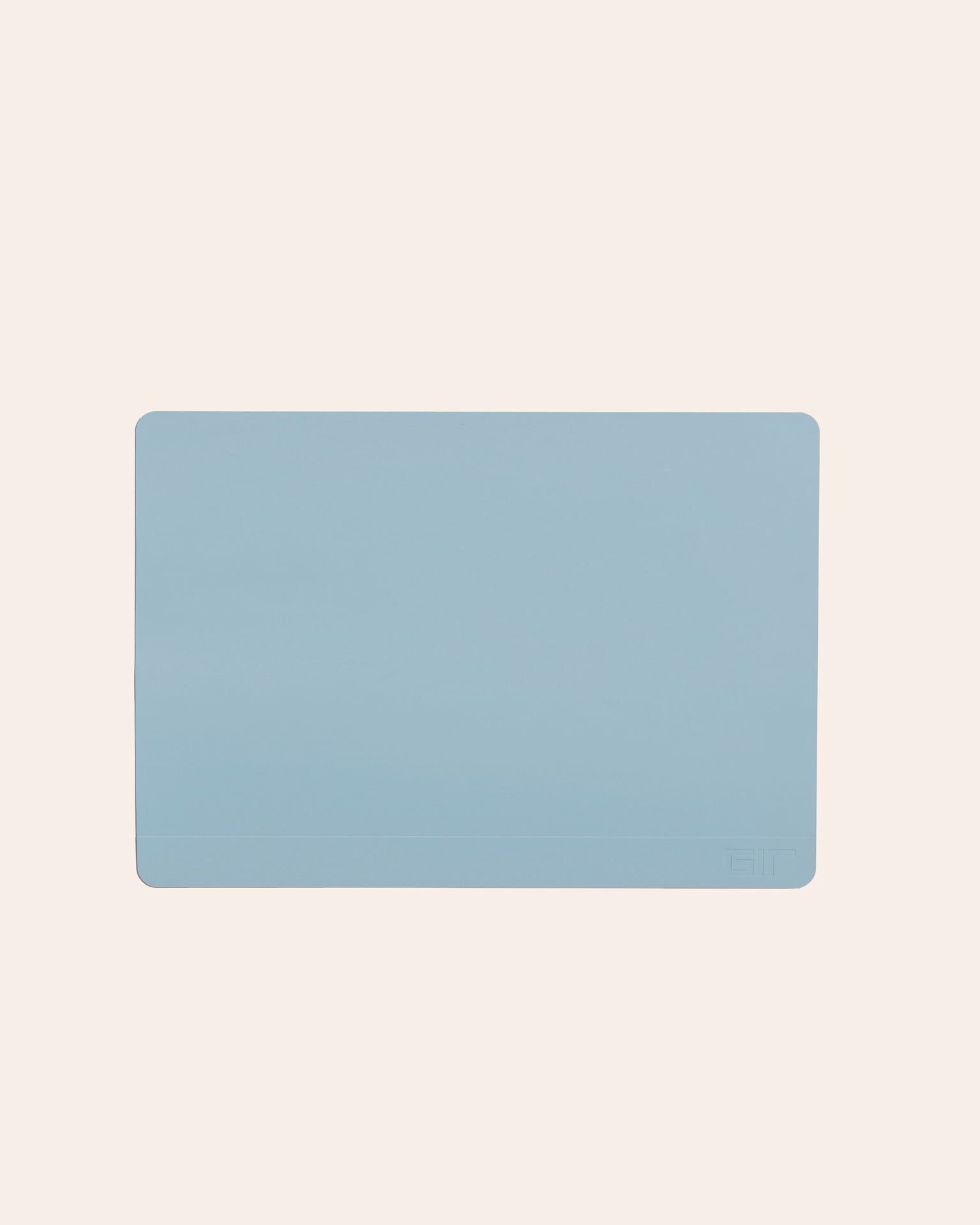 The Slate 12 x 17 Baking mat on a cream background. 